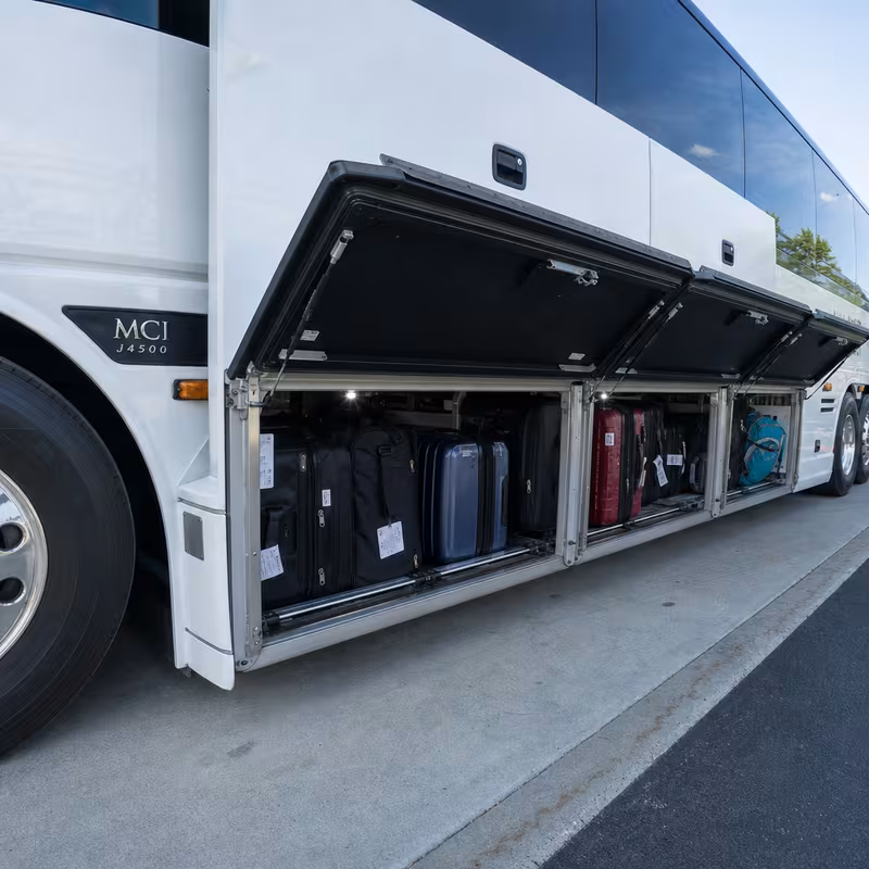 Party bus interior with wraparound leather seating and LED lighting in Dallas