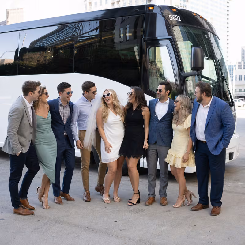 Passengers loading luggage while boarding an Dallas group shuttle