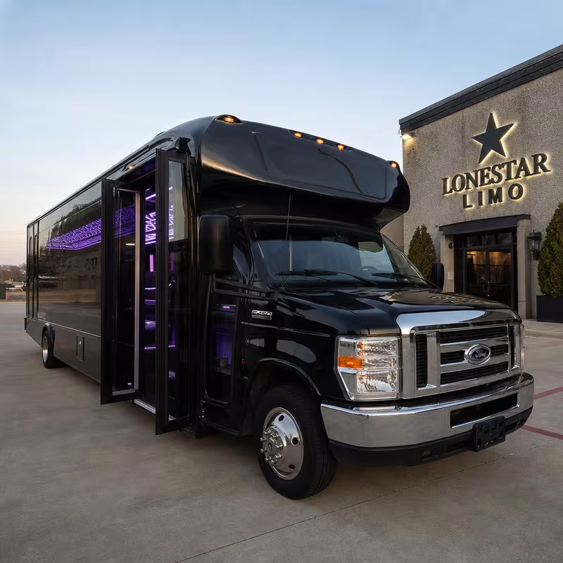 Party bus interior with wraparound leather seating and LED lighting in Dallas