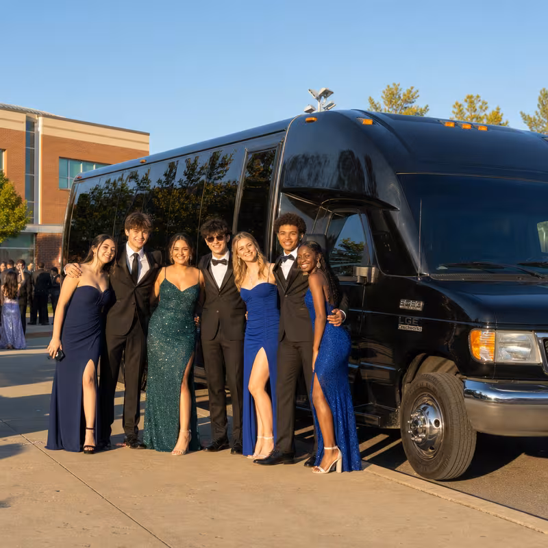 Group boarding a white charter bus for Prom & Homecoming Transportation transportation in Dallas