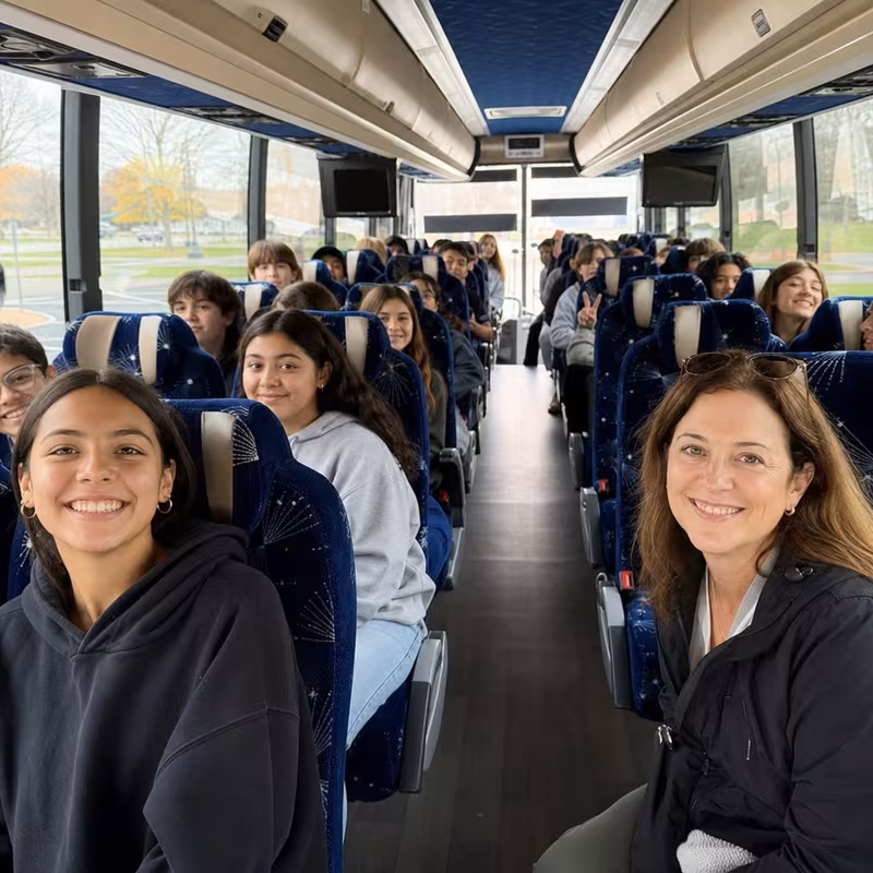 Group boarding a white charter bus for School Transportation transportation in Dallas