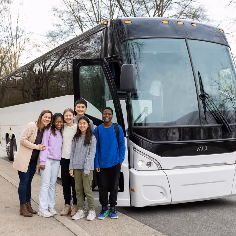 Passengers loading luggage while boarding an Dallas group shuttle
