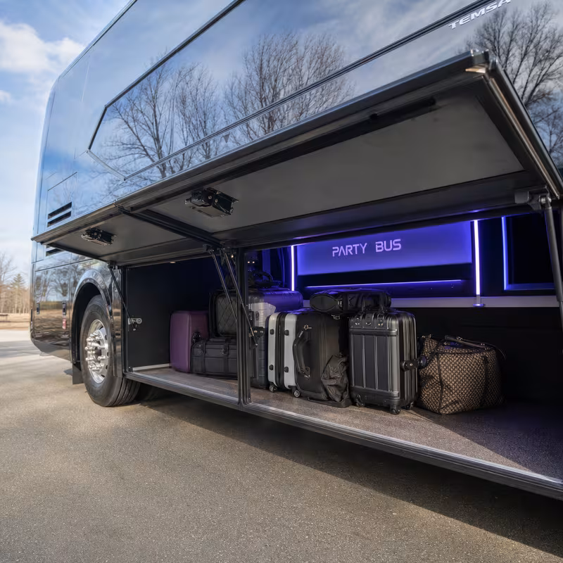 Party bus interior with wraparound leather seating and LED lighting in Dallas